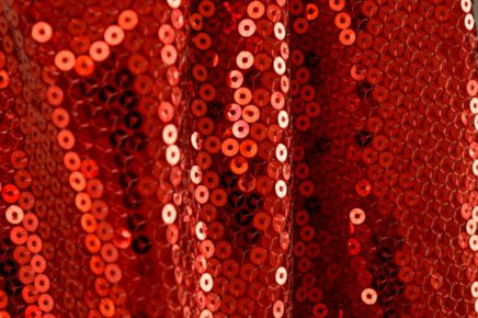red textile with sequins